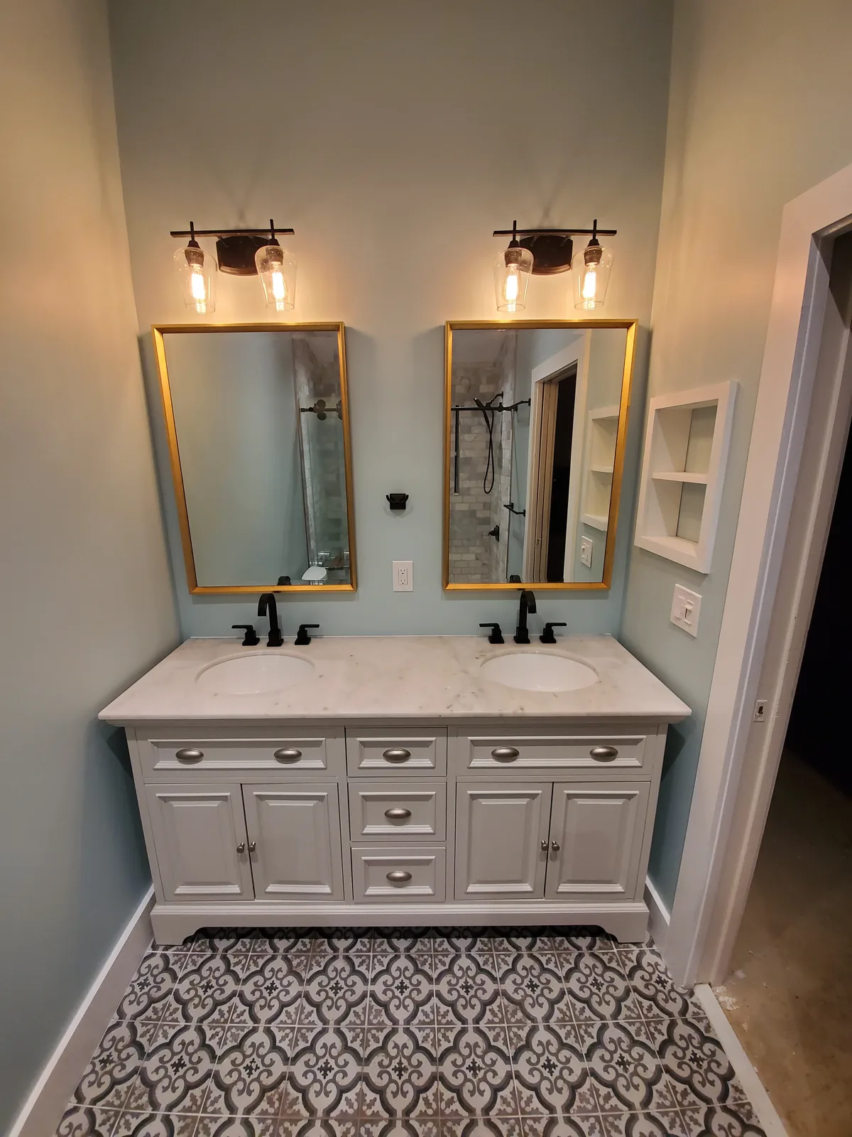 Custom home bathroom with double vanity by Red Spade Repairs in South Florida