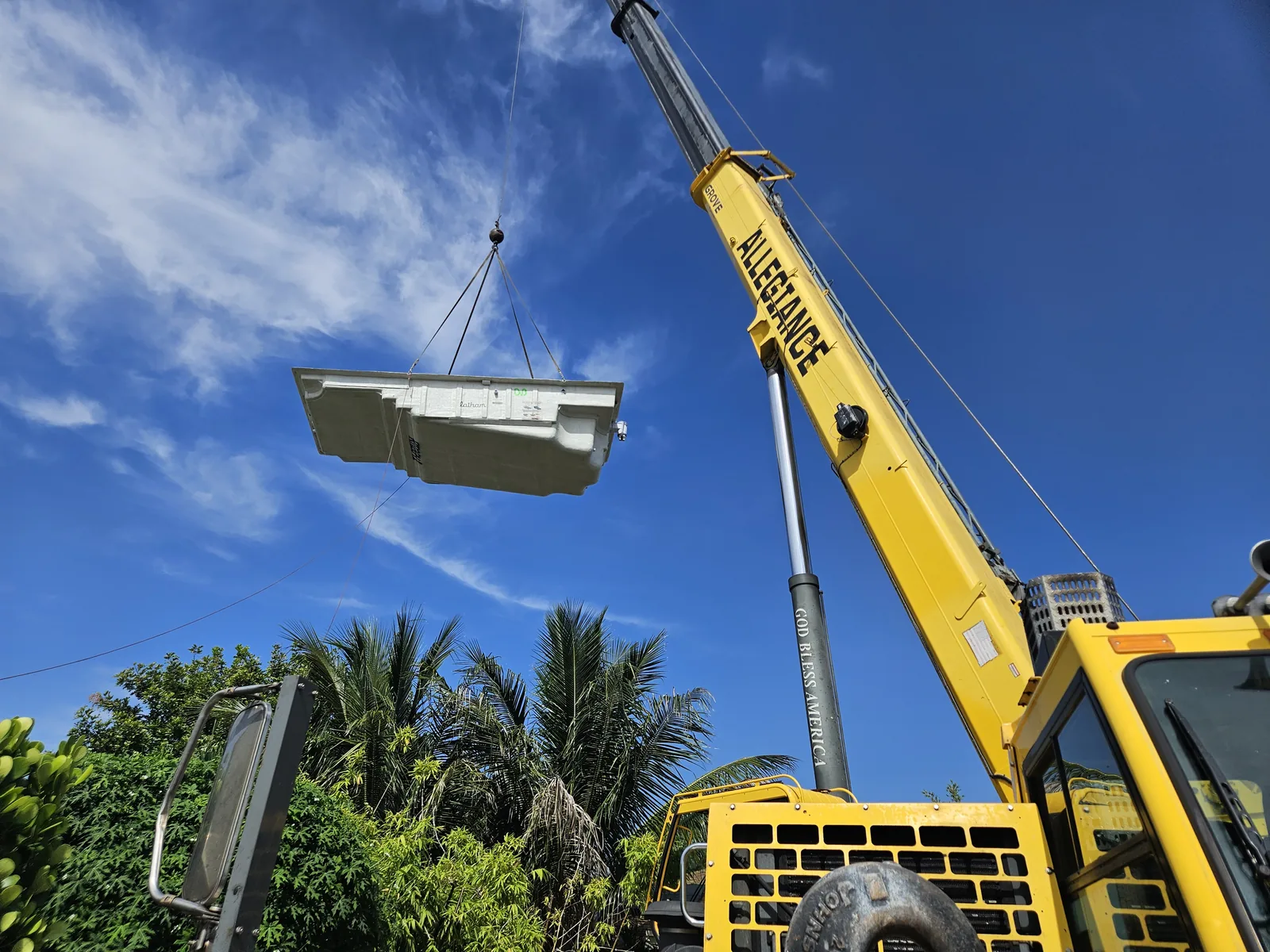 Setting a fiberglass pool shell by crane, Red Spade Repairs in South Florida