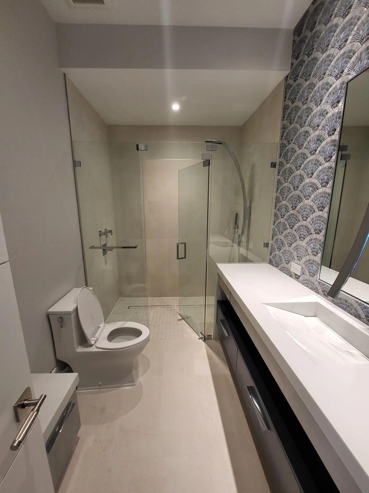 Finished modern bathroom in a new build by Red Spade Repairs in South Florida