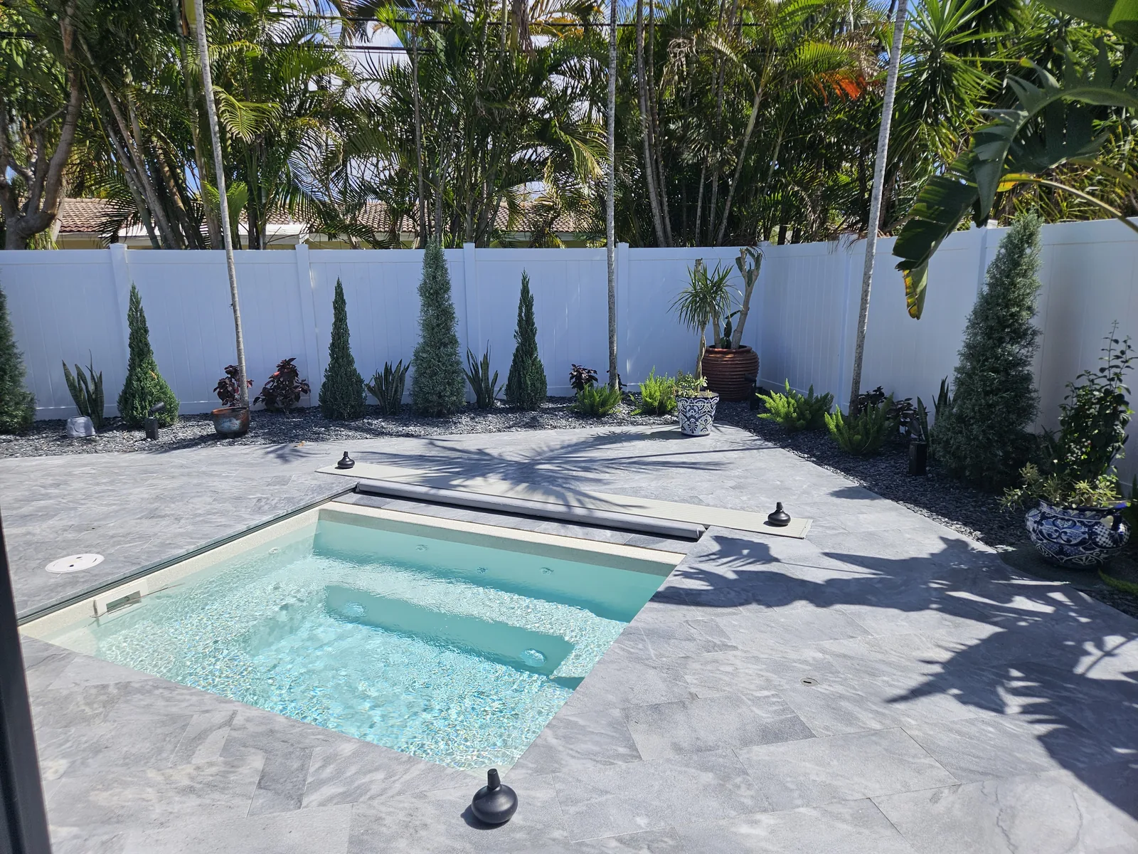 Backyard plunge pool and paver patio by Red Spade Repairs in South Florida